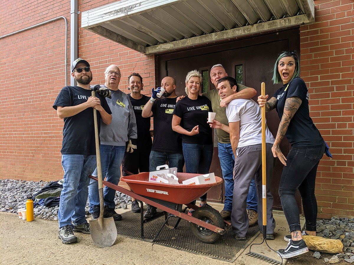LaZoom staff poses during a United Way volunteer day at Cane Creek Middle