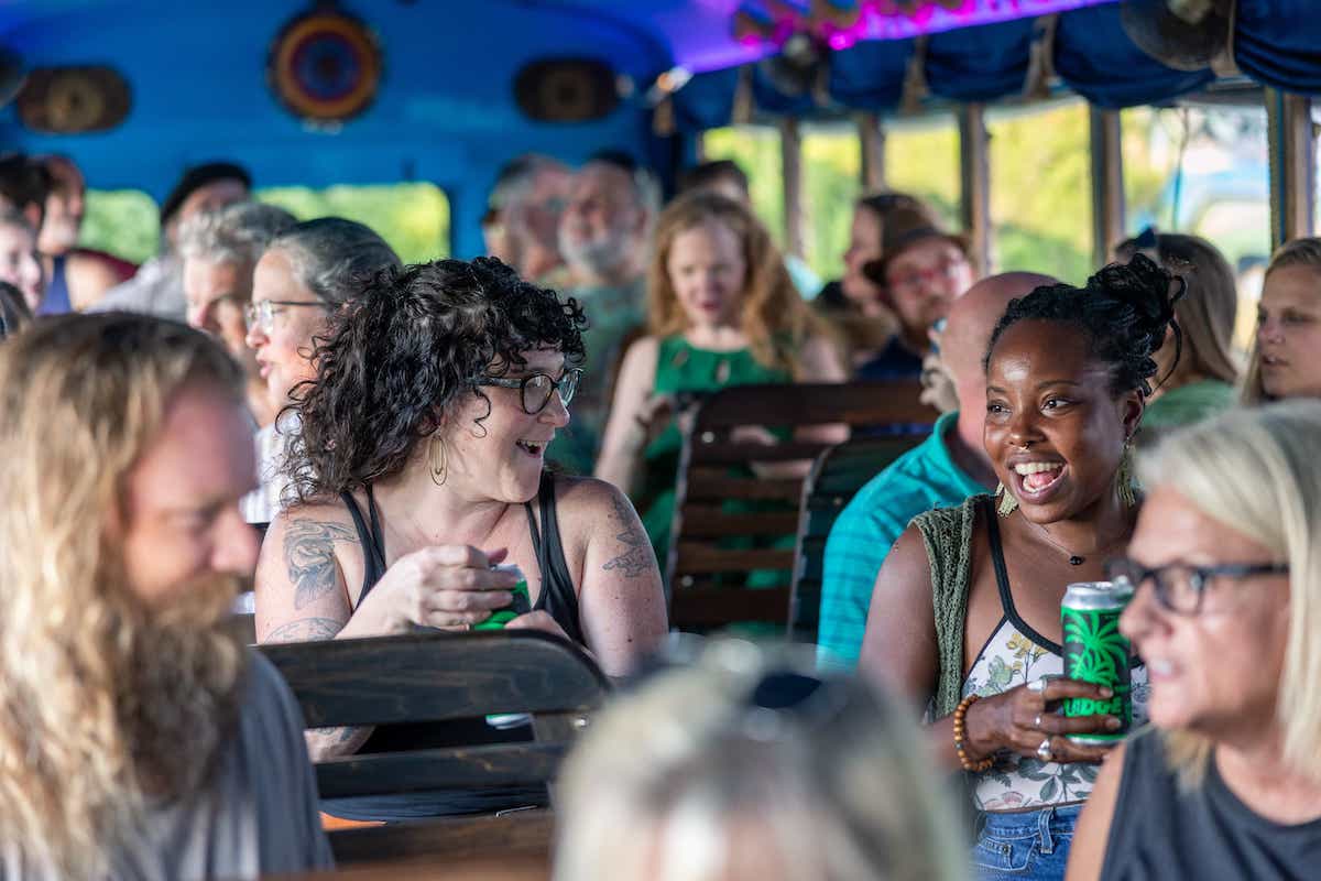 Photo of the audience on a ghosted tour, two women are laughing and smiling at eachother.