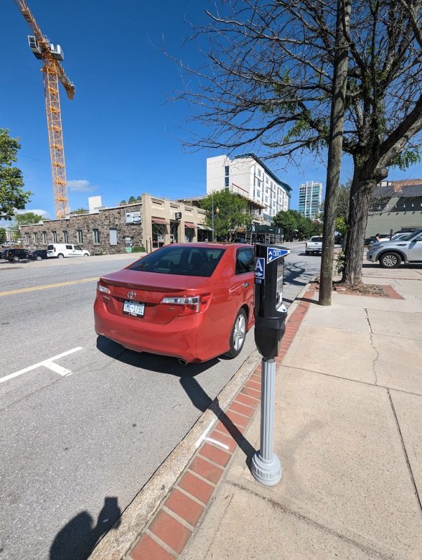 Metered parking spots along Biltmore Avenue, in front of the LaZoom Room